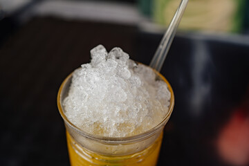 crushed ice in a glass of lemonade. serving soft drinks