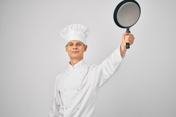 man in chef's clothes cooking service professional
