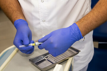 the doctor prepares anesthesia for the patient