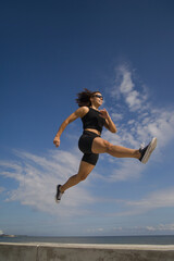 Fototapeta na wymiar athletic young woman exercising outdoors