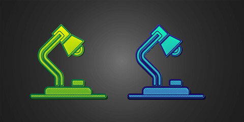 Green and blue Table lamp icon isolated on black background. Vector