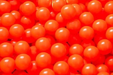 Texture - a large number of red balls, similar to toys or food, ripe fruits.