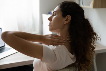 Woman touch stiff neck, experiencing sore shoulders and severe back problems, feels ache muscles...