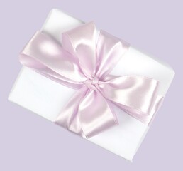 Festive box, decorated with a satin ribbon, mocap-an isolated element