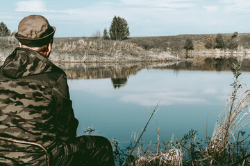 An adult man is fishing with a rod. Fishing.