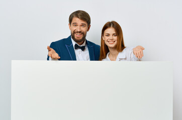 Man and woman advertising presentation white banner copy-space studio