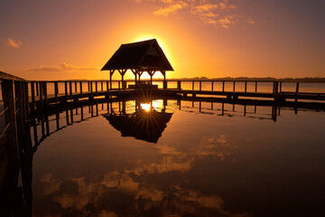Silhouette of a pier during the beautiful sunset - Powered by Adobe