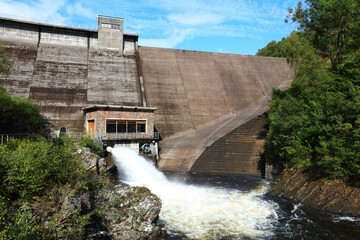 Water Gushing out of a Dam producing Hydroelectric Power, Glen finglas Reservoir, Trossachs, Scotland, UK.