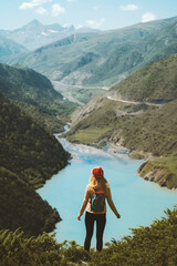 Fototapeta na wymiar Traveler woman hiking solo enjoying lake aerial view travel adventure vacations outdoor in mountains healthy lifestyle active weekend eco tourism concept