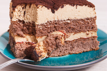 Tiramisu cake with different layers. Delicious dessert for celebrations