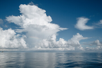 Ocean water and clouds with small waves