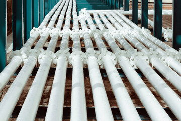 Steel long pipes and flange in crude tank oil factory during refinery Petrochemistry industry.
