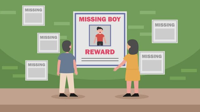 Sad parents put missing boy poster on the wall