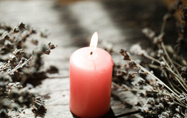 burning candle on a dark background