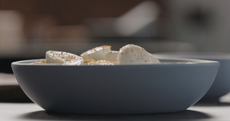 seasoning mozzarella on penne pesto