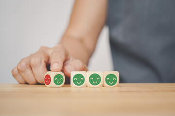 human hand's turning angry to happy face icon wood cube, change mood, temper control, mental...