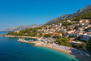 Fototapeta premium Aerial view of Gradac town below Biokovo mountain, the Adriatic Sea, Croatia