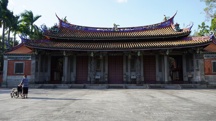 Naklejka premium Social distancing the elderly alone in the Chinese temple in the day time 