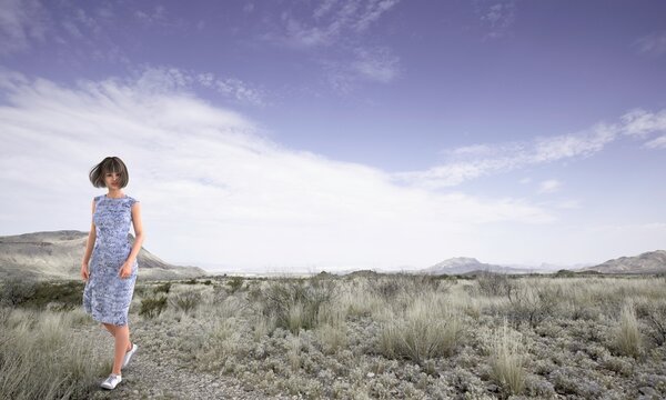 Woman walking, Big Bend National Park, Texas, USA. Person is not real. She is a 3D render thus no model release is needed.