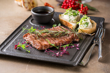 Butcher's steak, on a stone plate