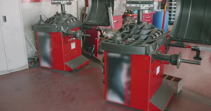 Car tire balancing machines in a workshop for repairing and replacing tires