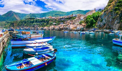 Poster Colorful fishing boats and transparent emerald sea of Calabria. Scilla medieval town. Italy © Freesurf