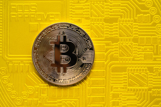 Bitcoin crypto currency on yellow paper background. top view with free space. electronic technology planing earn money investment and saving money future for 2022 new year.finance and business conept.