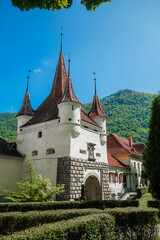 Red Spires on red tiled roof of Catherines gate, entrance to medieval city of Brasov Romania