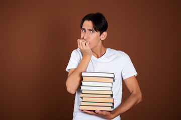 Rest and study at the university. Handsome guy with books.