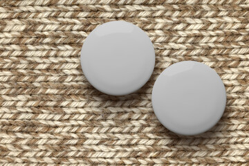 White round badge pin on brown knitted fabric. 3d rendering.