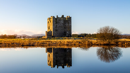Landscape of Threave Island and Castle reflecting on the River Dee in winter