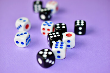 Dice are black and white on a purple background