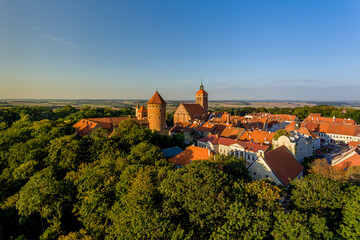 Panorama of the city of Reszel at sunrise, Castle and the Church of the Holy Apostles Peter and Paul in Reszel - Warmia and Masuria, Poland