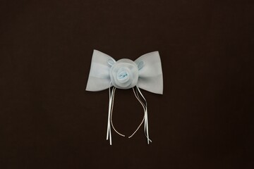 Light blue ribbon on black
