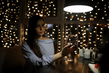 The girl in the evening rest in a cafe