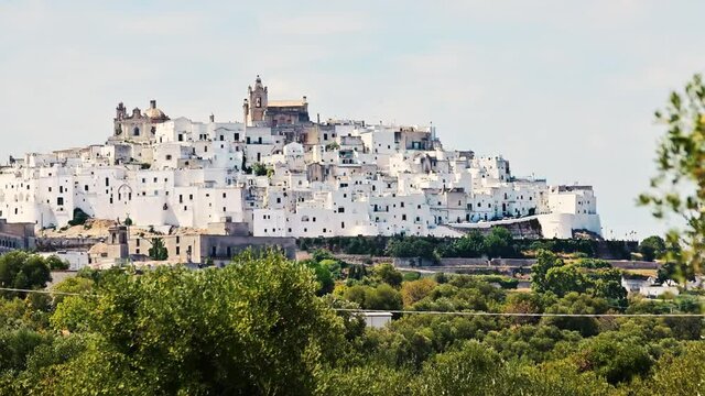 Amazing footage of the white city: Ostuni, Puglia, Italy. On the top of a hill, the historic center, characterized by its white color, stands out from the surrounding countryside.