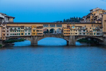 Fototapeta na wymiar Sunset on Ponte Vecchio - Old Bridge - in Florence, Italy. Amazing blue light before the evening.
