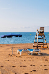 Sun loungers on an empty beach