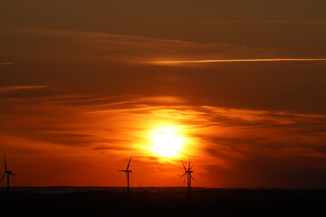 wind turbines at sunset