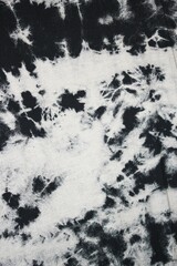 black and white Tie dye green background with layers of dye pattern fading from green to white dye fabric textile