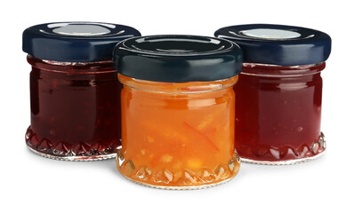 Jars with different jams on white background