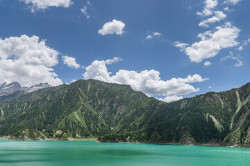 Snow mountains, grasslands, forests and lakes along G217 highway in Xinjiang, China in summer