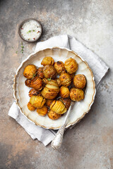 baked potatoes with thyme, rosemary and garlic