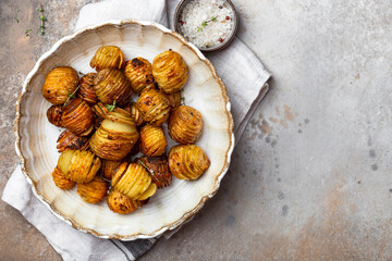 baked potatoes with thyme, rosemary and garlic