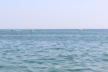 View of the sea from the yacht. Sunny day. Calm at sea. Sun glare plays on the water