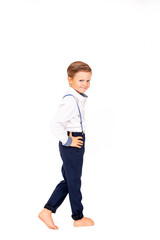 Fototapeta premium Cute boy child stylish in a white shirt on a white isolated background