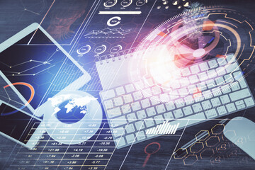 Double exposure of technology theme drawing over work table desktop. Top view. Global data analysis concept.