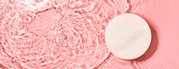 Transparent and clean pink water background with podium and sunlight reflection