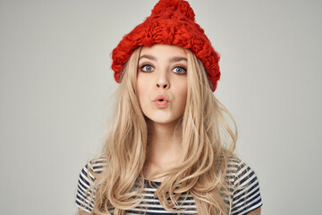 beautiful woman in fashionable clothes Red Hat posing Studio