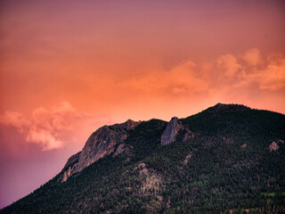 Pink and Orange sunset after glow on a mountain face in the Rocky Mountains